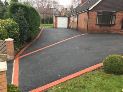 Large Tarmac Driveway Split Using Red Bricks